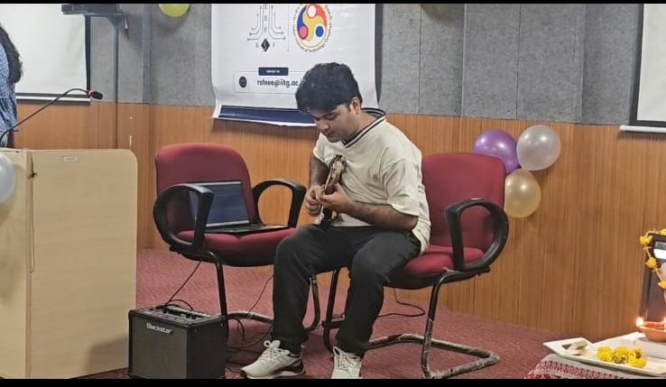 Kaushik performing on guitar